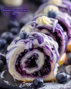 blueberry cheesecake rolls with icing and berries