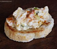 some kind of appetizer sitting on top of a piece of bread