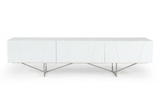 a white sideboard with metal legs and geometric design on the front, against a white background