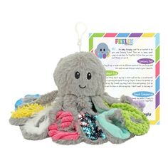 an octopus stuffed animal sitting on top of a pile of toys