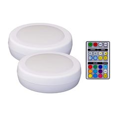 two white round lights with remotes on the side and an image of each one