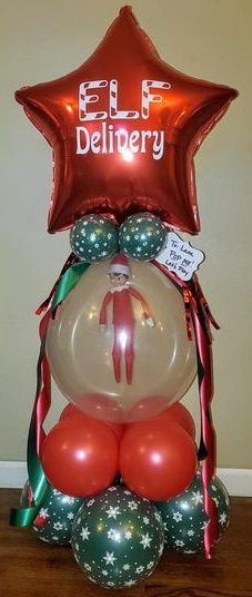 an elf balloon sitting on top of some balloons