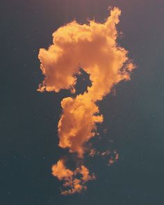 an orange cloud floating in the sky