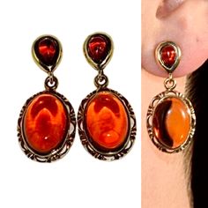 Fabulous drop earrings handcrafted of sterling silver covered 14ct. gold and natural Baltic amber.Amazing cherry amber stone (looks like drop of red wine) fitted in gold setting.This amazing jewellery suitable for everyday and evening wear.Amber stone created by nature over 25 millions years ego, amber attracts good luck, dissolves negative energy, balances emotions. Care Instructions: To maintain your jewellery, wipe gently with a cotton cloth that is soft and clean. Do not soak in water. Avoid Elegant Amber Sterling Silver Earrings, Classic Amber Earrings For Gift, Unique Baltic Amber Jewelry For Gifts, Formal Drop Cabochon Earrings, Gift Amber Drop Earrings, Amber Dangle Earrings For Anniversary, Amber Dangle Earrings For Formal Occasions, Handmade Baltic Amber Jewelry For Gifts, Handmade Baltic Amber Jewelry Gift