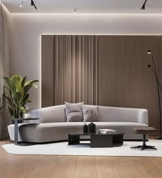 a living room filled with furniture next to a tall white vase on top of a hard wood floor