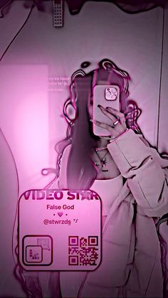 a woman holding a cell phone in front of a pink background with the words video star on it