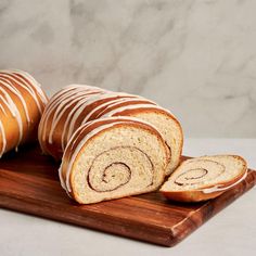 sliced loaf of cinnamon swirl bread on a cutting board