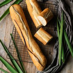 two loaves of bread sitting on top of a cooling rack