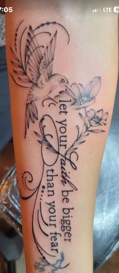 a woman's leg with a quote on it