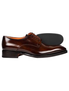 Santoni's artisanal savoir-faire meets modern-day requirements with a range of styles that fuse quality, elegance and everyday comfort. This hand-polished leather Derby shoe is characterised by a classic wide-fit silhouette that gently embraces the foot for maximum comfort. Thanks to its extra-special flexible Goodyear construction, the sole can be folded almost entirely in half, ensuring an exceptionally lightweight feel and superior freedom of movement for optimal comfort. This shoe can also b Luxury Semi-formal Derby Shoes With Branded Insole, Semi-formal Goodyear Welted Derby Shoes In Calf Leather, Brown Semi-formal Derby Shoes With Round Toe, Semi-formal Brown Wingtip Derby Shoes, Brown Leather-lined Monk Strap Shoes For Derby, Appointment Book, Derby Shoes, Derby, Baskets