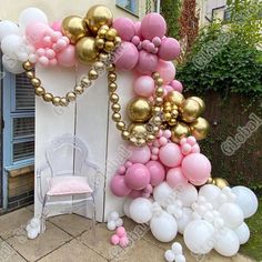 a bunch of balloons that are on the side of a building with a chair next to it