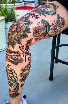 a person with tattoos on their legs and feet