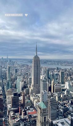 an aerial view of the empire building in new york city, ny with clouds overhead