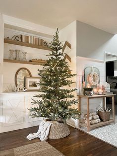 a living room with a christmas tree in the corner