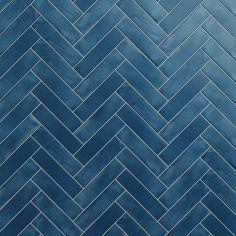 a blue tile wall with herringle pattern