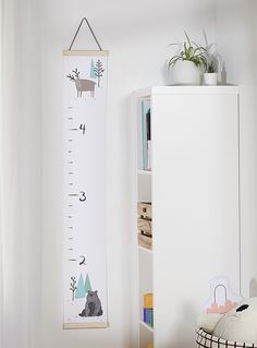 a child's growth chart hanging on the wall