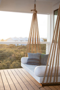 an image of a porch swing that is on the website for furniture and decor stores