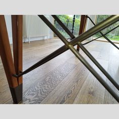 a wooden floor with some metal bars on it