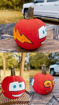 two pumpkins with faces painted on them sitting on a table in front of a truck