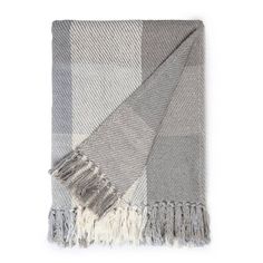 a grey and white checkered blanket with fringes