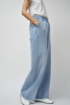 Wide leg jean cut in 100% cotton Japanese denim. High waisted with fully elasticated waistband and side slip pockets. Cool girl oversized slouchy fit and feel. DETAILS 100% Cotton. Made in Portugal. Machine Wash Cold. FIT Model is 5'11 U.S Size 0 wearing a size 34 pant. 34: Waist: 24", Hip: 39", Inseam: 30", Rise: 11.5". 36: Waist: 26", Hip: 41", Inseam: 31.5", Rise: 12". 38: Waist: 28", Hip: 43", Inseam: 32", Rise: 12.5" 40: Waist: 29", Hip: 45", Inseam: 32", Rise: 13". 42: Waist: 30", Hip: 47" Elastic Waist Jeans, Japanese Denim, Leg Jeans, Cool Girl, Fitness Models, Elastic Waist, Wide Leg, Light Blue, High Waisted