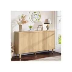 the sideboard is made from wood and has an oval design on it, along with plants