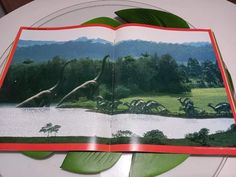 an open book sitting on top of a white plate