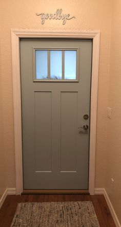 the front door to a home with a welcome mat