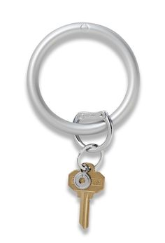 a metal key ring with two keys attached to the front and back of it, on a white background