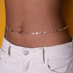 Delicate, simple, and perfect for everyday wear. Give your look a subtle upgrade with this classic belly chain. Materials: 18K Gold Plated, Cubic Zirconia, Brass Length: 25" Belly Chain with 3" extension chain (Sizes Available) *Hypoallergenic, Lead and Nickel Free, Tarnish Resistant Care: Our jewelry is designed to be water-resistant, so you don't have to worry about taking it off when you're near water. However, we recommend limiting prolonged exposure to water to keep your jewelry looking its Rainbow Prism, Belly Chain, Belly Rings, Purse Jewelry, Purse Wallet, Jewelry Box, Cubic Zirconia, Jewelry Accessories, Everyday Wear