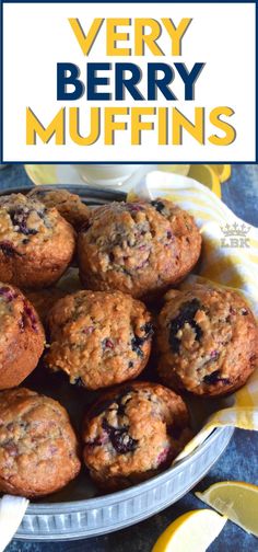 blueberry muffins in a bowl with lemon wedges