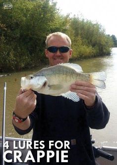 a man holding a fish in his hands