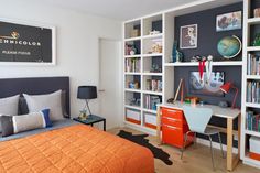 a bedroom with a bed, desk and bookshelves