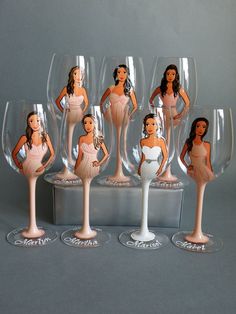 there are six wine glasses with different pictures on the bottom one has a bridesmaid in it