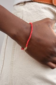 Beaded red bamboo coral bracelet Subtly vibrant and exquisitely strung Crafted to be worn alone or elegantly stacked Measures approx 7” 14k gold ball clasp Red bamboo coral is known to be a protective talisman against evil spirits. It is said to bring luck to the home, and is used as a protector Made using ethically sourced coral from the Philippines Ethically made in Los Angeles Bracelets sold individually Designer: Beatrice Valenzuela | Learn more about the Designer and shop the collection. Red Single Strand Beaded Bracelet, Elegant Red Coral Beaded Bracelets With Round Beads, Elegant Red Coral Beaded Bracelets, Elegant Coral Beaded Bracelets, Coral Red Coral Beaded Bracelets, Elegant Red Coral Beaded Bracelets With Adjustable Fit, Elegant Red Beaded Bracelets With Lobster Clasp, Protection From Evil Spirits, Protective Talisman