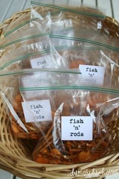 fish n'rods party snack bags in a basket with labels reading fish n'rods party snacks