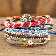 several bracelets are stacked on top of each other