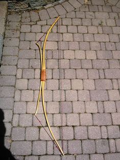 a bow and arrow laying on the ground