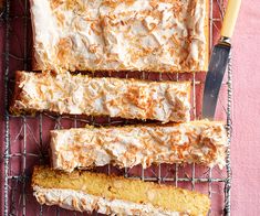 four pieces of cake sitting on top of a cooling rack