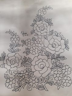 a bunch of flowers that are on top of a piece of paper