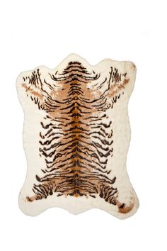 a brown and white animal print rug on a white background with an orange tiger stripe