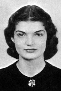 an old black and white photo of a woman