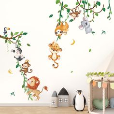 wall decals with monkeys and other animals hanging from the branches