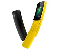 a yellow cell phone sitting in the middle of a stand with it's door open