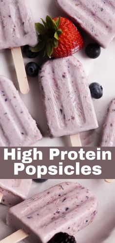 popsicles with blueberries and strawberries on them are shown in the foreground text reads high protein popsicles