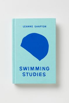 a book with the title swimming studies written in blue ink on it's cover