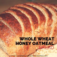 whole wheat honey oatmeal bread on a cutting board with the words, whole wheat honey oatmeal bread