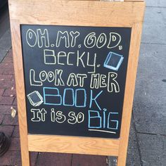 a chalkboard sign that reads oh my god, beryl look at the book it is so big