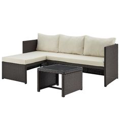 an outdoor furniture set with white cushions