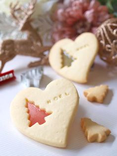 two heart shaped cookies sitting next to each other